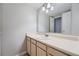 Bathroom with vanity, mirror, and light beige colored walls at 6420 S Dayton St # J06, Englewood, CO 80111