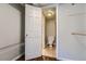 Small half bathroom with toilet and tile floor at 6420 S Dayton St # J06, Englewood, CO 80111