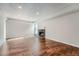 Living room with hardwood floors and a brick fireplace at 6420 S Dayton St # J06, Englewood, CO 80111