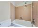 Clean bathroom with beige tile and shower/tub combo at 6420 S Dayton St # J06, Englewood, CO 80111