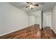 Bedroom with mirrored closet doors and wood floors at 6420 S Dayton St # J06, Englewood, CO 80111