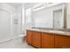 Bathroom with double vanity and shower at 9674 Truckee St, Commerce City, CO 80022