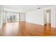 Spacious living room with hardwood floors and access to backyard at 9674 Truckee St, Commerce City, CO 80022