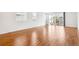 Bright and airy living room with hardwood floors and sliding glass doors at 9674 Truckee St, Commerce City, CO 80022