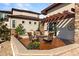Back patio with firepit, seating, and grill, next to the house at 4473 Echo Dr, Larkspur, CO 80118