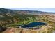 Bird's eye view of a golf course community near a lake at 4473 Echo Dr, Larkspur, CO 80118