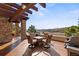 Back patio with firepit and seating area, overlooking scenic mountain views at 4473 Echo Dr, Larkspur, CO 80118