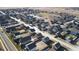 Aerial view of a neighborhood showing a street of houses at 2963 Rose Hill St, Strasburg, CO 80136