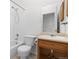 Clean bathroom with a vanity, toilet and bathtub at 2963 Rose Hill St, Strasburg, CO 80136