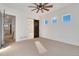 Bedroom with barn door entry to bathroom, ceiling fan at 23835 E River Front Dr, Aurora, CO 80019