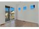 Bright office space with sliding glass doors leading to deck at 23835 E River Front Dr, Aurora, CO 80019