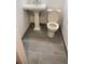 Small bathroom with pedestal sink and tiled floor at 677 Vrain St # 3, Denver, CO 80204