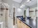 Bathroom with a modern double vanity and black vessel sinks at 6220 Salvia St, Arvada, CO 80403