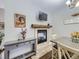 Cozy dining area with fireplace and built-in shelving at 6220 Salvia St, Arvada, CO 80403