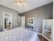 Bedroom with ceiling fan, hardwood floors, and access to other rooms at 6220 Salvia St, Arvada, CO 80403