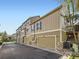 Tan colored townhome with attached garage at 6220 Salvia St, Arvada, CO 80403