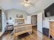 Bedroom with hardwood floors, dresser, and ceiling fan at 6220 Salvia St, Arvada, CO 80403