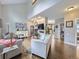 Spacious living room with hardwood floors, vaulted ceilings, and fireplace at 6220 Salvia St, Arvada, CO 80403