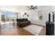 Living room with hardwood floors and sliding glass doors at 27840 E 7Th Pl, Aurora, CO 80018