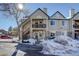 Townhouse exterior with snowy landscaping at 4079 S Crystal Cir # 201, Aurora, CO 80014