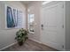 Inviting entryway with modern artwork and hardwood-style flooring at 5186 N Quemoy Ct, Aurora, CO 80019