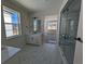 Elegant bathroom with a walk-in shower, vanity, and tiled floors at 5088 Hickory Oaks St, Castle Rock, CO 80104