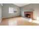 Living room with brick fireplace at 3564 S Jasper Way, Aurora, CO 80013