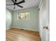 Light green bedroom with hardwood floors and ceiling fan at 3564 S Jasper Way, Aurora, CO 80013