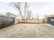 Grass backyard with a wooden fence and pergola at 1698 S Garfield St, Denver, CO 80210