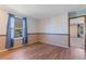 Bedroom with wood flooring and access to another room at 10438 Holland Pl, Broomfield, CO 80021