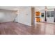 Open concept living and dining area with hardwood floors at 10438 Holland Pl, Broomfield, CO 80021