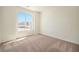Spacious bedroom featuring a large window and neutral wall colors at 6153 N Ceylon St # 205, Denver, CO 80249
