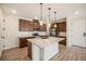 Modern kitchen with island and stainless steel appliances at 6153 N Ceylon St # 205, Denver, CO 80249