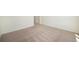 Well-lit bedroom with carpeted floor and ample space at 6153 N Ceylon St # 205, Denver, CO 80249