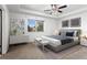 Main bedroom with ceiling fan and neutral decor at 11735 Helena St, Commerce City, CO 80022