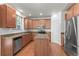 Kitchen with stainless steel appliances and island at 11735 Helena St, Commerce City, CO 80022