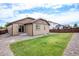 Landscaped backyard with grassy area and gravel perimeter at 41 S Jackson Gap Way, Aurora, CO 80018