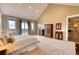 Luxurious main bedroom with high ceilings and access to a private deck at 5236 Bear Mountain Dr, Evergreen, CO 80439