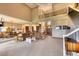 Open floor plan with a large living area, high ceilings, and views of the kitchen and dining areas at 5236 Bear Mountain Dr, Evergreen, CO 80439