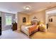 Bedroom with queen-size bed and views of trees at 5236 Bear Mountain Dr, Evergreen, CO 80439