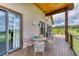 Relaxing deck with table and chairs, offering scenic views of the surrounding landscape at 5236 Bear Mountain Dr, Evergreen, CO 80439