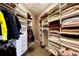 Large walk-in closet with ample shelving and drawers at 5236 Bear Mountain Dr, Evergreen, CO 80439