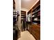 Large walk-in closet with custom built-ins and hanging space at 5236 Bear Mountain Dr, Evergreen, CO 80439