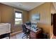 Bright home office features a large window with mountain views, a desk, and computer monitors at 5236 Bear Mountain Dr, Evergreen, CO 80439