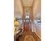 Elegant entryway showcasing a grand wooden door and high ceilings at 5236 Bear Mountain Dr, Evergreen, CO 80439