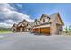 Stunning two-story home with stone accents and a three-car garage at 5236 Bear Mountain Dr, Evergreen, CO 80439