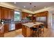 Modern kitchen with ample cabinetry, granite countertops, and stainless steel appliances at 5236 Bear Mountain Dr, Evergreen, CO 80439