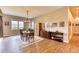 Bright dining room with hardwood floors and ample natural light at 5236 Bear Mountain Dr, Evergreen, CO 80439