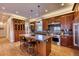 Gourmet kitchen boasts stainless steel appliances and an expansive island at 5236 Bear Mountain Dr, Evergreen, CO 80439