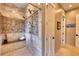 Large walk-in shower with multiple shower heads and mosaic tile at 5236 Bear Mountain Dr, Evergreen, CO 80439